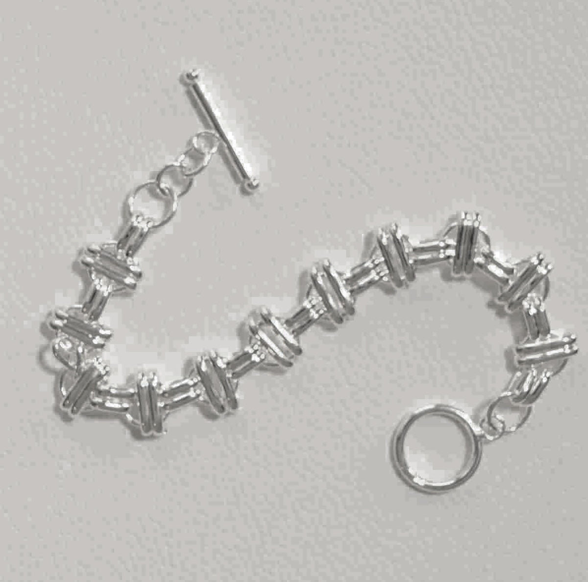 Sterling Silver Interlinked Grace Double Bar and Spaced Circles Bracelet with Toggle Clasp