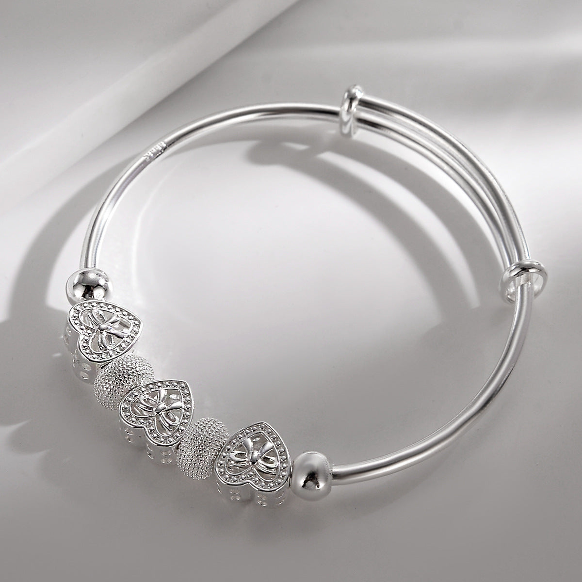 Elegant Sterling Silver Heart Charm Bracelet with Adjustable Bangle