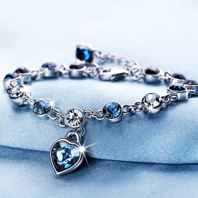 Elegant Sterling Silver Heart Bracelet with Blue Zirconia