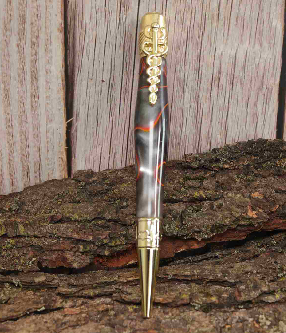 A Bold Tribute to Healthcare Heroes: Handcrafted Orange, Black, and Silver Spectrum Acrylic Caduceus Twist Pen with Golden Hardware