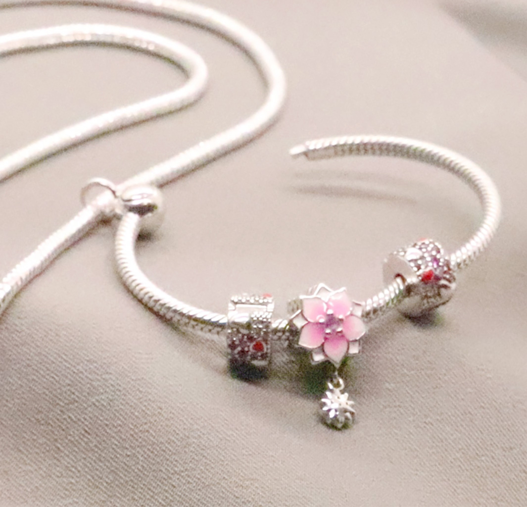 Blossom of Love – Sterling Silver O Charm Pendant with Sparkling Red CZ and Charming Pink Flower Bead Charm. 925ijewel.com