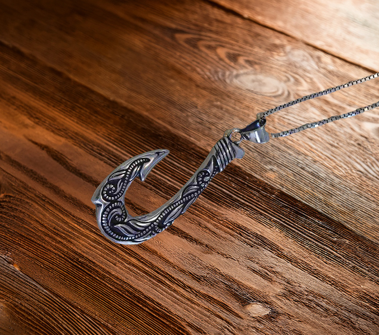 Sterling silver platinum look fishing hook with intricate design. 925ijewel.com