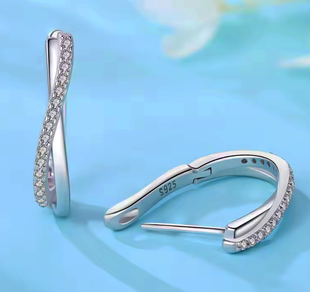 Eternal Spark Sterling Silver Duo Twist Oval Hoop Earrings. 925ijewel.com
